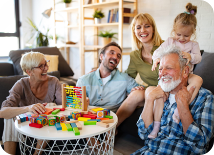 Older adult and child smiling together during a shared activity, representing intergenerational friendship and bonding