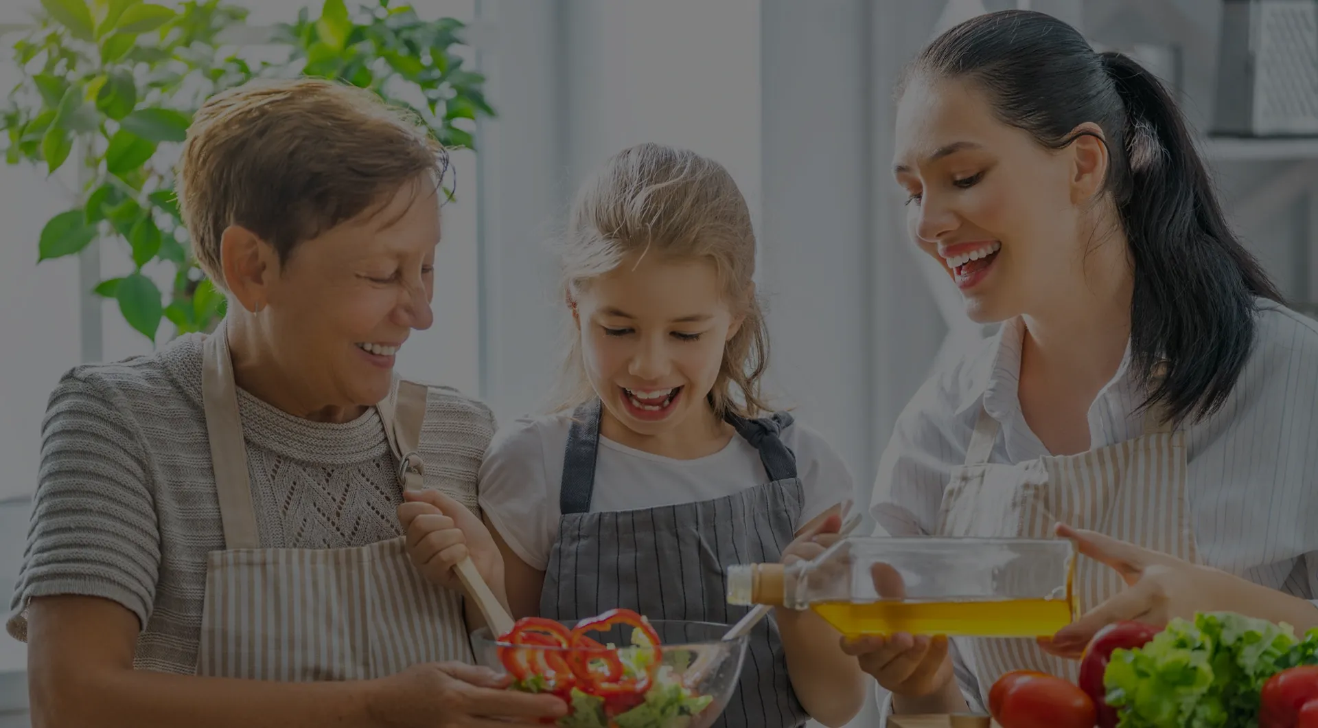 Grandmother, mother, and daughter cooking together and sharing an intergenerational moment